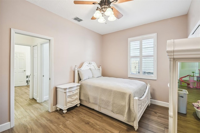 14003 Sobrado Dr, Orlando, FL 32837 - bedroom featuring baseboards, light wood-type flooring, and a ceiling fan