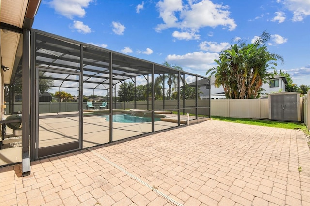 14003 Sobrado Dr, Orlando, FL 32837 - view of patio / terrace featuring a storage unit, fence, a lanai, and an outdoor structure
