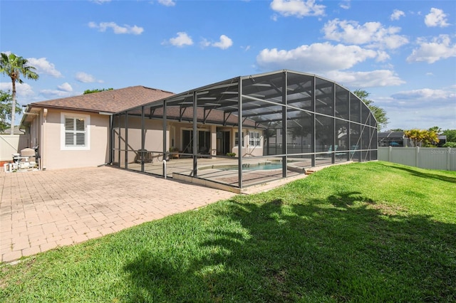 14003 Sobrado Dr, Orlando, FL 32837 - rear view of house featuring an outdoor pool, a patio area, stucco siding, a lanai, and a jacuzzi
