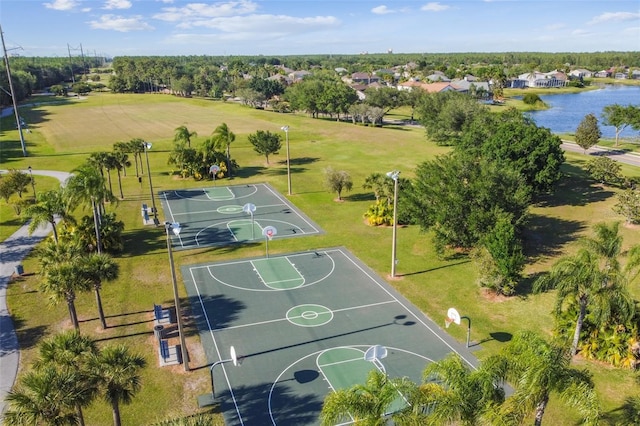 14003 Sobrado Dr, Orlando, FL 32837 - view of basketball court with community basketball court, a water view, and a yard