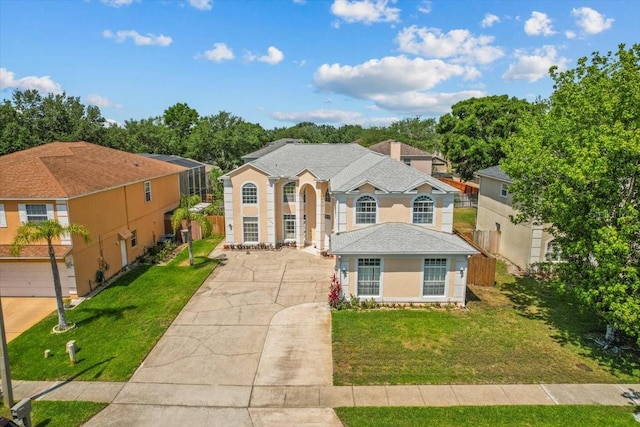 1240 Falconcrest Blvd, Apopka, FL 32712 - traditional-style house featuring concrete driveway, a front yard, and stucco siding