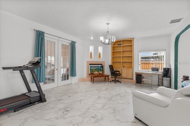 1240 Falconcrest Blvd, Apopka, FL 32712 - living area featuring french doors, a chandelier, marble look tile flooring, and a textured ceiling