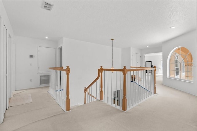 1240 Falconcrest Blvd, Apopka, FL 32712 - hall featuring an upstairs landing, carpet floors, recessed lighting, and a textured ceiling