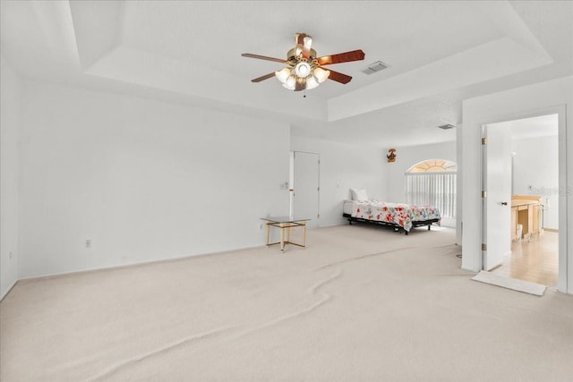 1240 Falconcrest Blvd, Apopka, FL 32712 - carpeted bedroom featuring a raised ceiling and ceiling fan