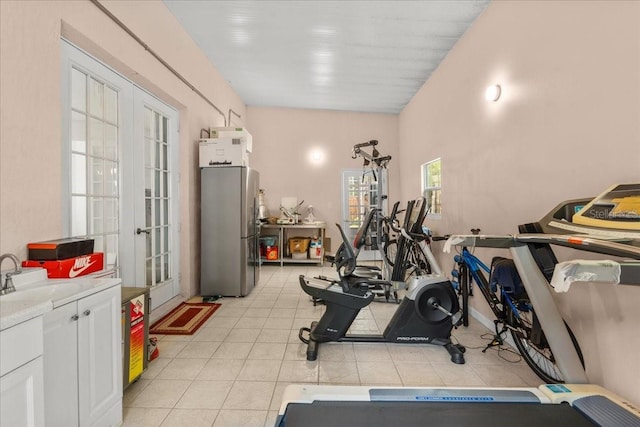 1240 Falconcrest Blvd, Apopka, FL 32712 - workout room featuring french doors and light tile patterned floors