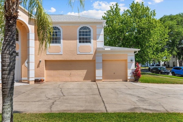 1240 Falconcrest Blvd, Apopka, FL 32712 - view of front facade featuring driveway, stucco siding, and an attached garage