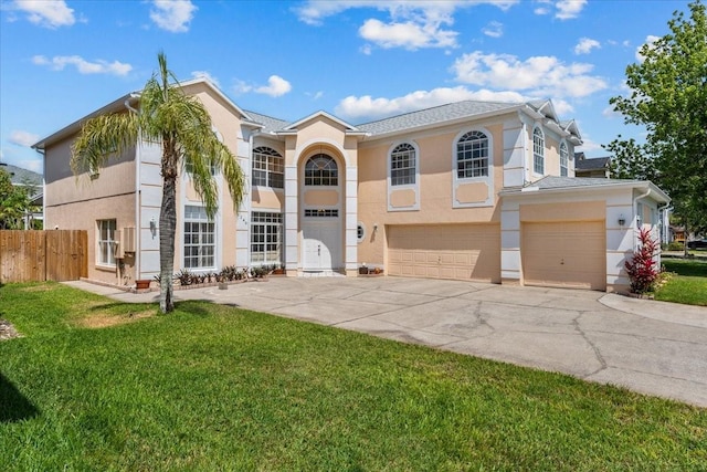 1240 Falconcrest Blvd, Apopka, FL 32712 - view of front of home featuring driveway, stucco siding, an attached garage, and roof with shingles
