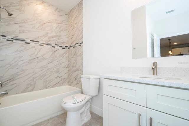 bathroom with toilet, shower / washtub combination, vanity, visible vents, and baseboards