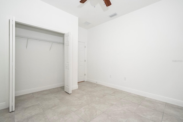 unfurnished bedroom featuring a ceiling fan, baseboards, a closet, and visible vents