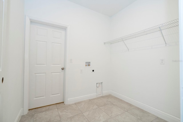 washroom with baseboards, light tile patterned floors, hookup for a washing machine, laundry area, and electric dryer hookup