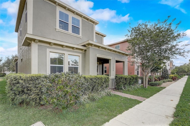 17084 Harbor Oak Pkwy, Winter Garden, FL 34787 - view of front of home featuring stucco siding and a front yard