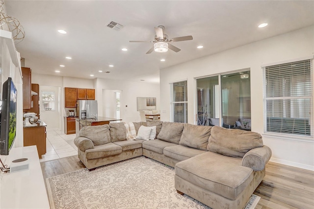 17084 Harbor Oak Pkwy, Winter Garden, FL 34787 - living area with a ceiling fan, recessed lighting, light wood-type flooring, and baseboards