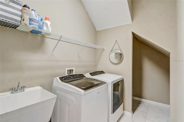 17084 Harbor Oak Pkwy, Winter Garden, FL 34787 - laundry room featuring light marble finish flooring, washer and dryer, and baseboards