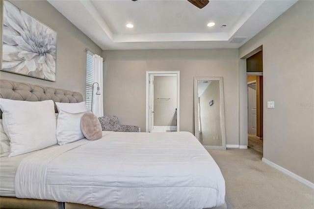 17084 Harbor Oak Pkwy, Winter Garden, FL 34787 - bedroom with light colored carpet, baseboards, a tray ceiling, recessed lighting, and ensuite bathroom