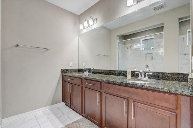 17084 Harbor Oak Pkwy, Winter Garden, FL 34787 - full bathroom featuring marble look tile flooring, baseboards, a shower stall, and double vanity