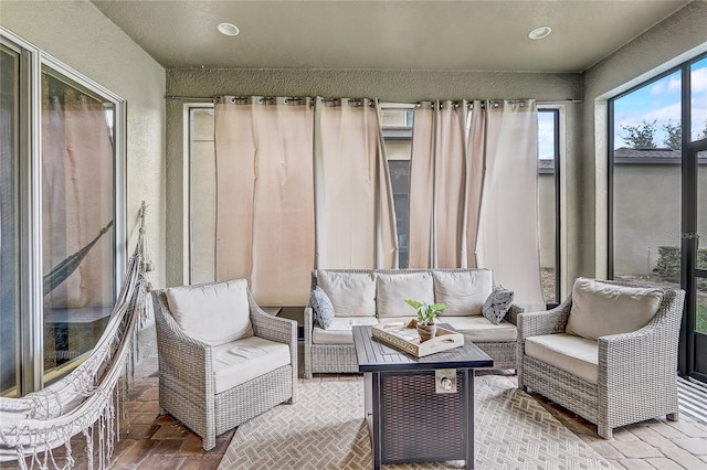 17084 Harbor Oak Pkwy, Winter Garden, FL 34787 - sunroom / solarium featuring outdoor lounge area, brick patterned floors, and recessed lighting