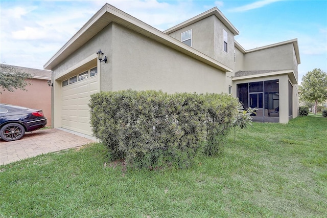 17084 Harbor Oak Pkwy, Winter Garden, FL 34787 - view of home's exterior featuring a garage, stucco siding, a lawn, and decorative driveway