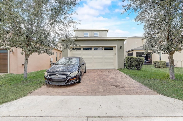 17084 Harbor Oak Pkwy, Winter Garden, FL 34787 - traditional-style house with decorative driveway, stucco siding, a front lawn, and a garage