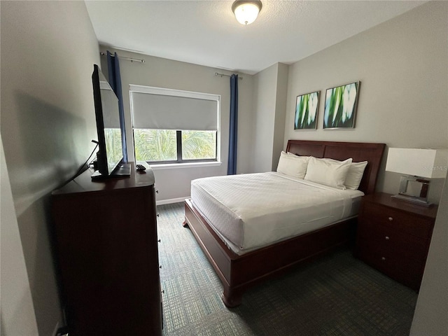 14501 Grove Resort Unit 1409, Winter Garden, FL 34787 - bedroom featuring dark carpet and baseboards
