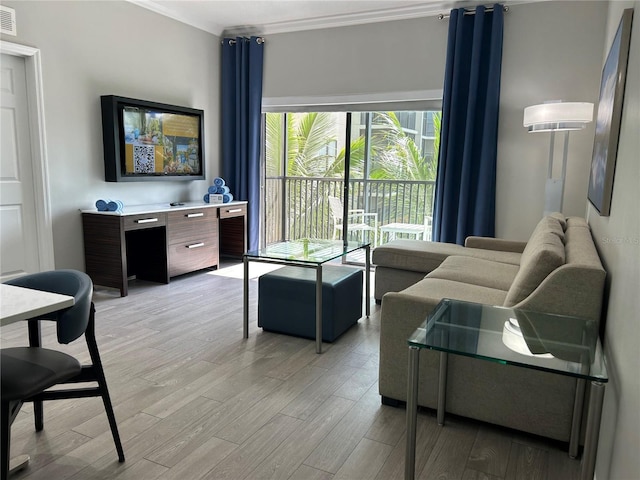 14501 Grove Resort Unit 1409, Winter Garden, FL 34787 - living room with light wood-style floors and ornamental molding