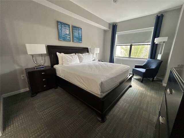 14501 Grove Resort Unit 1409, Winter Garden, FL 34787 - bedroom featuring dark carpet and baseboards