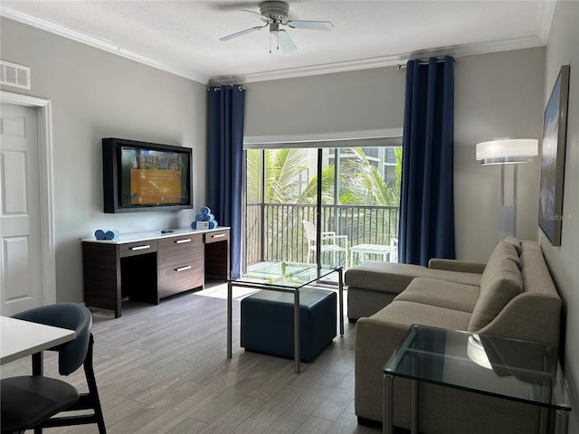 14501 Grove Resort Unit 1409, Winter Garden, FL 34787 - living area featuring ornamental molding, light wood finished floors, and ceiling fan