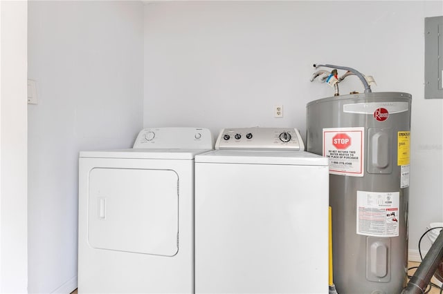 washroom featuring water heater, washer and dryer, and electric panel