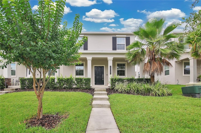 15060 Book Club Rd, Winter Garden, FL 34787 - view of front of home with stucco siding, a front lawn, and covered porch