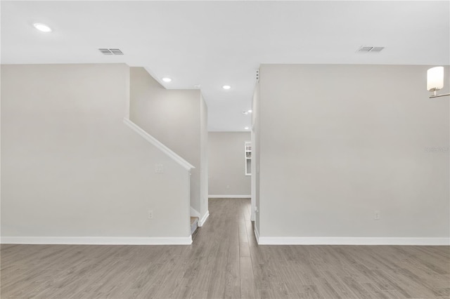 15060 Book Club Rd, Winter Garden, FL 34787 - spare room with light wood-style floors, stairs, and recessed lighting