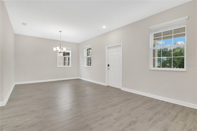 15060 Book Club Rd, Winter Garden, FL 34787 - unfurnished room featuring a chandelier, wood finished floors, and recessed lighting