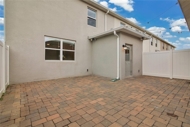 15060 Book Club Rd, Winter Garden, FL 34787 - rear view of property with a patio area and stucco siding
