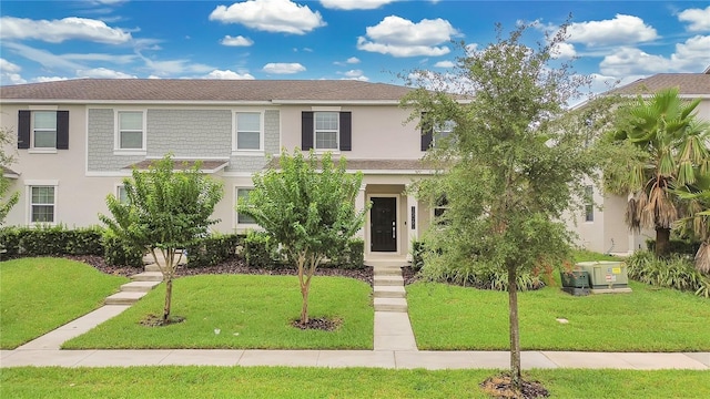 15060 Book Club Rd, Winter Garden, FL 34787 - view of front facade featuring stucco siding and a front lawn