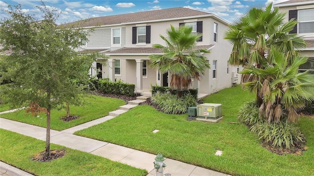 15060 Book Club Rd, Winter Garden, FL 34787 - view of front of property featuring stucco siding, a front yard, and a shingled roof