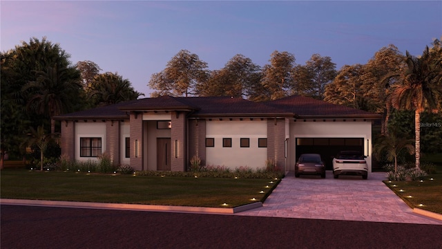12818 Brunello Cir, Clermont, FL 34711 - view of front of house featuring a garage, a front yard, and driveway