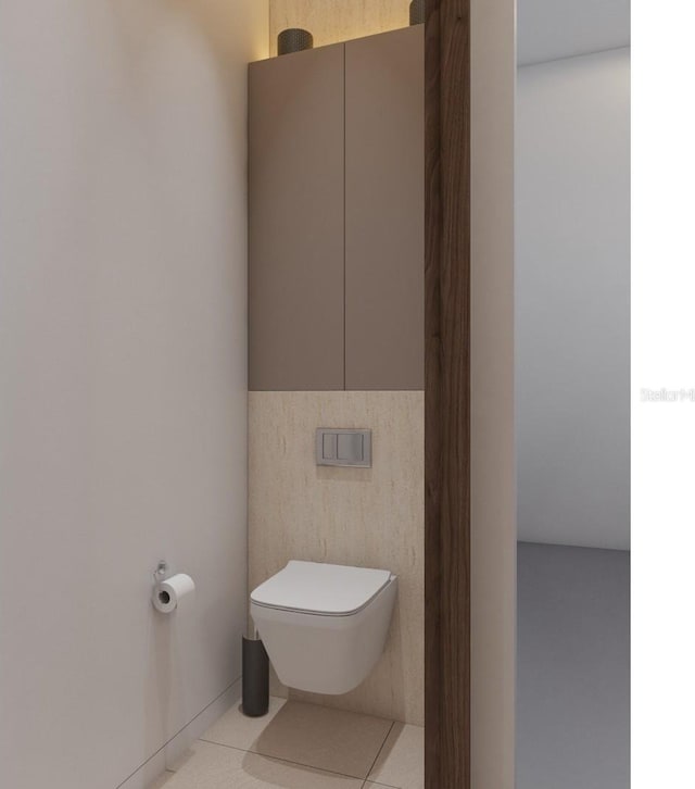 12818 Brunello Cir, Clermont, FL 34711 - bathroom featuring toilet, tile patterned flooring, and tile walls