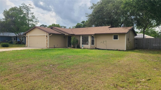 ranch-style home featuring an attached garage and driveway