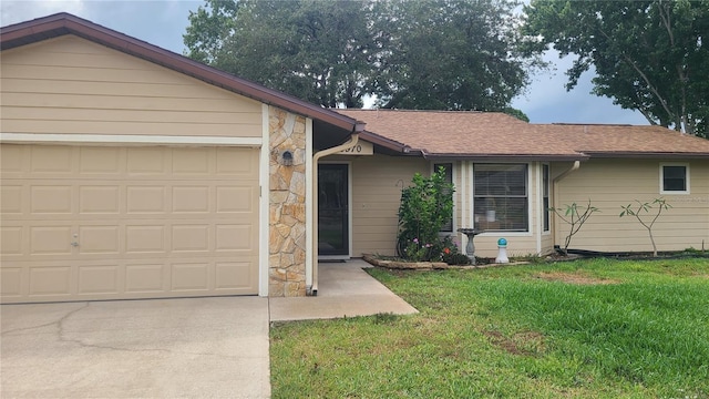 ranch-style house with a garage, stone siding, a front yard, driveway, and a shingled roof