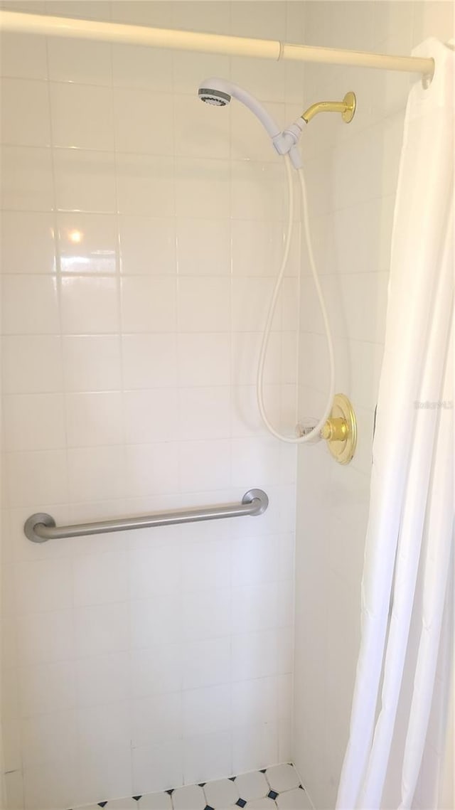 bathroom featuring a shower stall