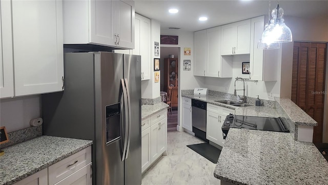 kitchen featuring a sink, stainless steel appliances, white cabinets, and recessed lighting