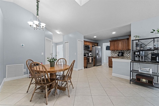 dining room featuring a chandelier, light tile patterned flooring, baseboards, lofted ceiling, and recessed lighting