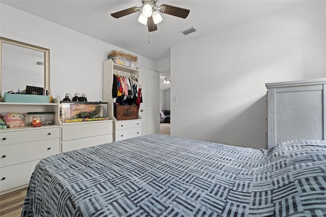 bedroom with ceiling fan and light wood finished floors