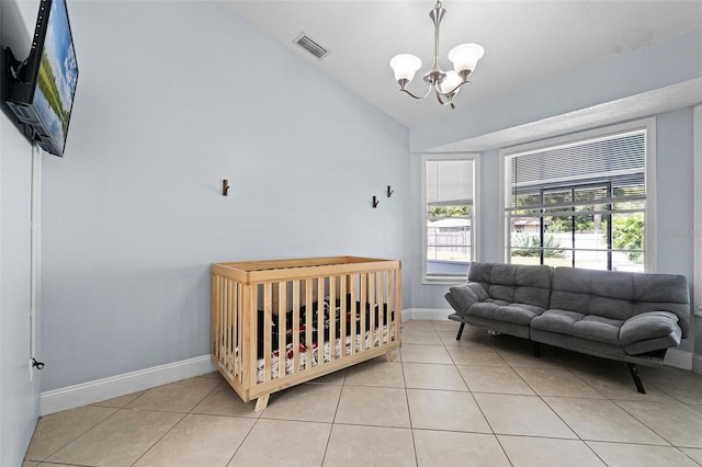 bedroom featuring a chandelier, light tile patterned floors, baseboards, and lofted ceiling