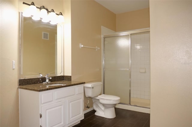 bathroom with a stall shower, wood finished floors, toilet, and vanity