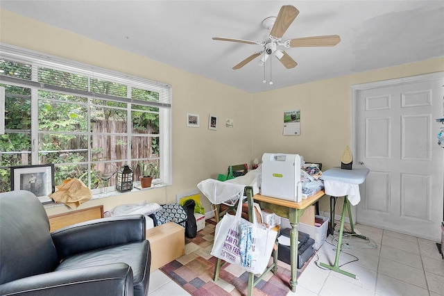 interior space featuring a ceiling fan and light tile patterned floors