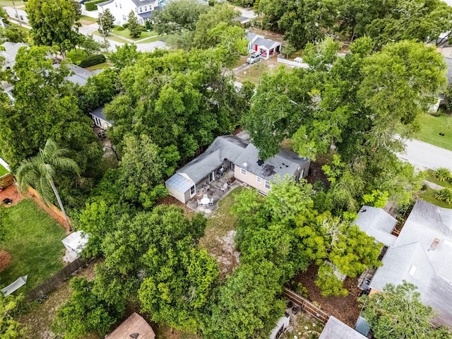 aerial perspective of suburban area featuring a tree filled landscape