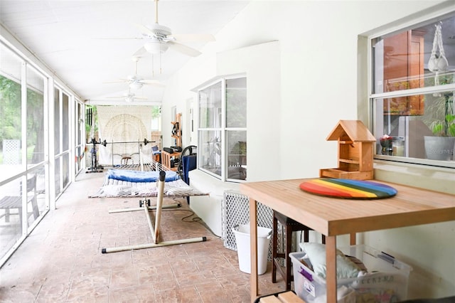 1430 Arrowhead Trl, Deltona, FL 32725 - sunroom / solarium featuring plenty of natural light, lofted ceiling, and stone finish floors