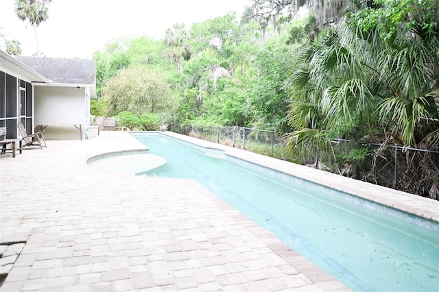 1430 Arrowhead Trl, Deltona, FL 32725 - view of swimming pool with fence, a sunroom, and a patio