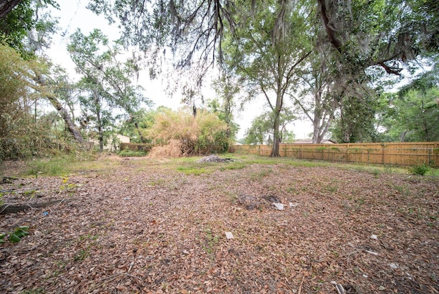 view of yard featuring fence