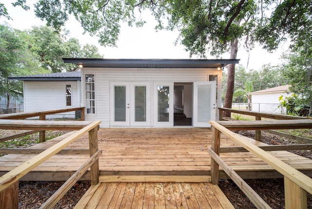 wooden deck featuring french doors