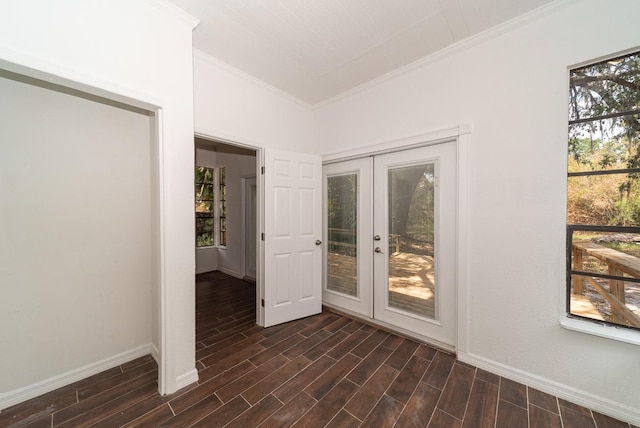 doorway to outside featuring crown molding, plenty of natural light, baseboards, dark wood finished floors, and french doors